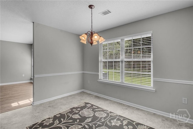 116 Gloucester Dr, Midway, GA 31320 - empty room featuring a chandelier and a textured ceiling
