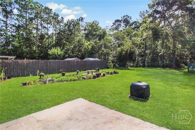 116 Gloucester Dr, Midway, GA 31320 - view of yard featuring a patio