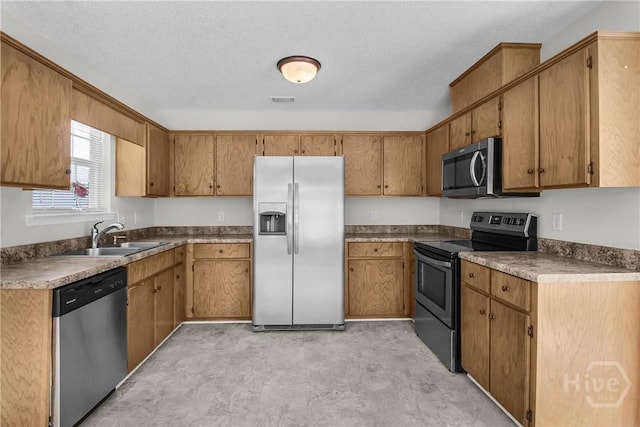 116 Gloucester Dr, Midway, GA 31320 - kitchen featuring stainless steel appliances and brown cabinetry