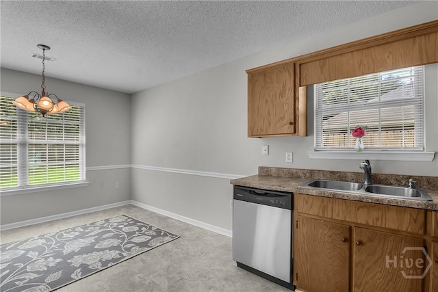 116 Gloucester Dr, Midway, GA 31320 - kitchen with dishwasher, a textured ceiling, decorative light fixtures, a chandelier, and brown cabinetry