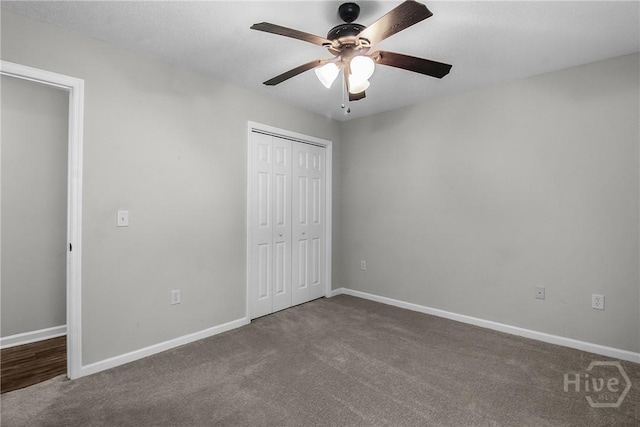 116 Gloucester Dr, Midway, GA 31320 - unfurnished bedroom with dark carpet, a closet, and ceiling fan