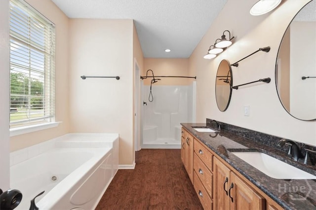 301 Marshview Dr, Richmond Hill, GA 31324 - full bath with walk in shower, a jetted tub, double vanity, and a textured ceiling