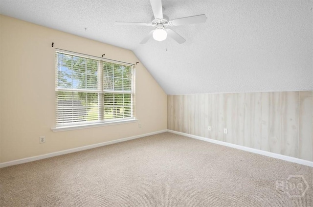 301 Marshview Dr, Richmond Hill, GA 31324 - additional living space with carpet flooring, a textured ceiling, ceiling fan, and vaulted ceiling