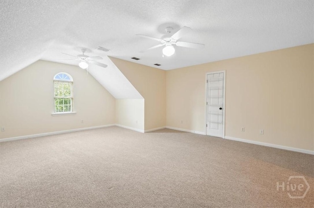 301 Marshview Dr, Richmond Hill, GA 31324 - additional living space with ceiling fan, carpet, a textured ceiling, and vaulted ceiling