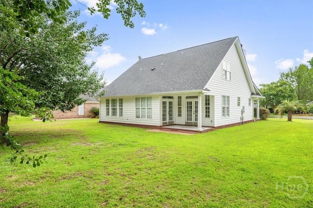 301 Marshview Dr, Richmond Hill, GA 31324 - back of house with french doors, a lawn, and roof with shingles