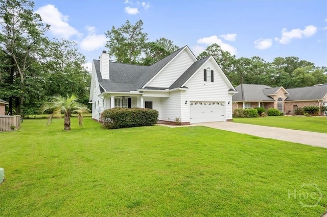 301 Marshview Dr, Richmond Hill, GA 31324 - view of front of home with driveway, a chimney, a front lawn, and an attached garage