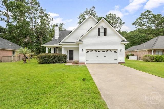 301 Marshview Dr, Richmond Hill, GA 31324 - traditional-style home with a chimney, a front yard, concrete driveway, and an attached garage