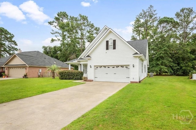 301 Marshview Dr, Richmond Hill, GA 31324 - view of front facade featuring a front lawn, a garage, and driveway
