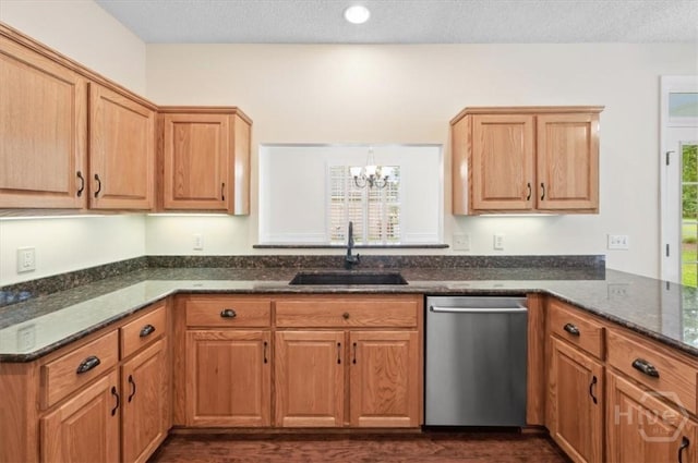 301 Marshview Dr, Richmond Hill, GA 31324 - kitchen featuring stainless steel dishwasher, a chandelier, dark stone counters, dark wood finished floors, and a peninsula
