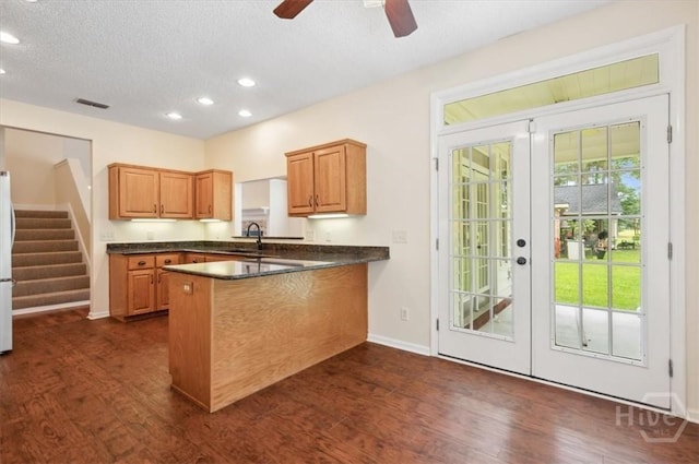 301 Marshview Dr, Richmond Hill, GA 31324 - kitchen featuring french doors, dark countertops, a peninsula, dark wood-style floors, and recessed lighting