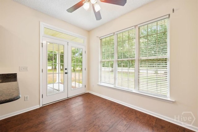 301 Marshview Dr, Richmond Hill, GA 31324 - entryway with french doors, dark wood finished floors, ceiling fan, and plenty of natural light