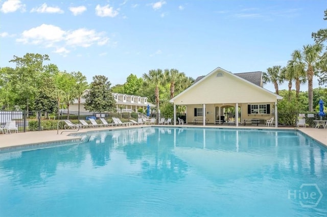 301 Marshview Dr, Richmond Hill, GA 31324 - community pool featuring a patio area