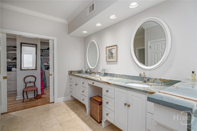 3 She Crab Cir, Savannah, GA 31411 - bathroom with ornamental molding, double vanity, a walk in closet, recessed lighting, and tile patterned floors