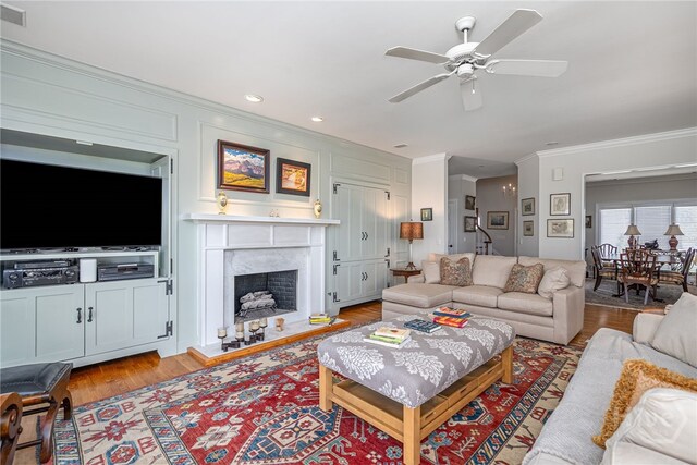 3 She Crab Cir, Savannah, GA 31411 - living area featuring ornamental molding, ceiling fan, a premium fireplace, and wood finished floors