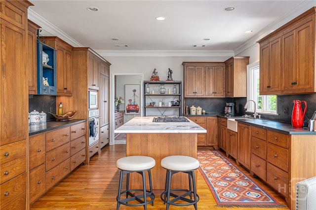 3 She Crab Cir, Savannah, GA 31411 - kitchen featuring open shelves, light wood-style flooring, appliances with stainless steel finishes, crown molding, and recessed lighting