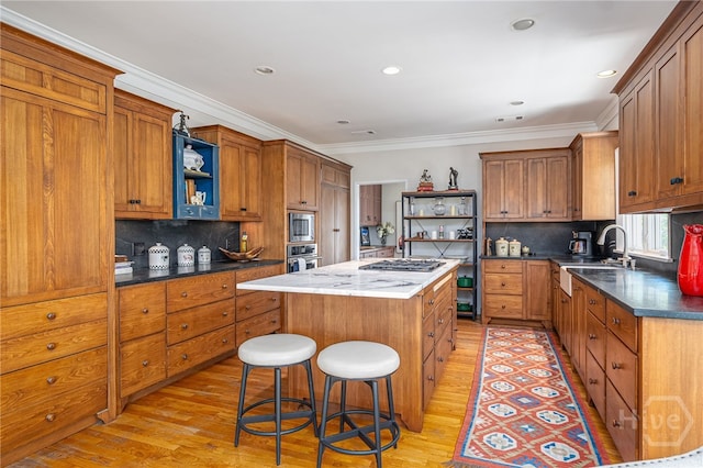3 She Crab Cir, Savannah, GA 31411 - kitchen featuring open shelves, stainless steel appliances, light wood-type flooring, a kitchen island, and ornamental molding