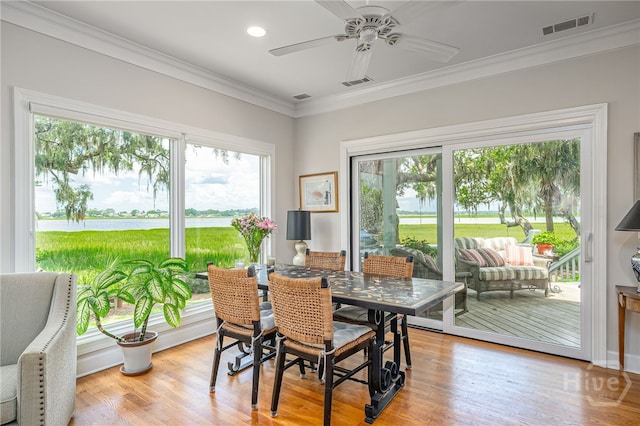 3 She Crab Cir, Savannah, GA 31411 - dining room featuring crown molding, ceiling fan, a water view, light wood-type flooring, and recessed lighting