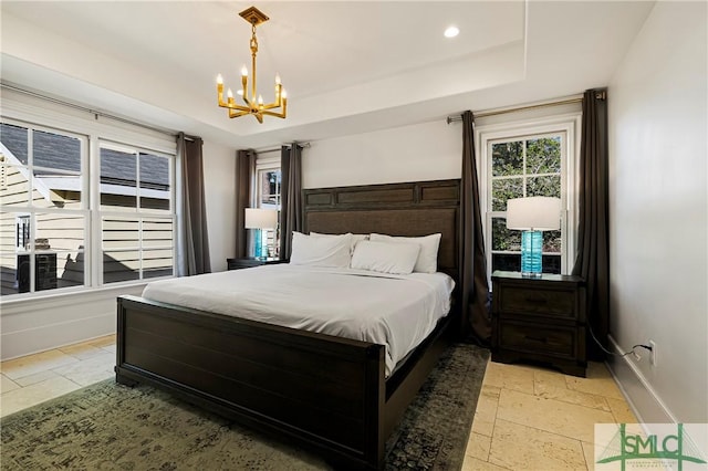 52-56 E Broad St, Savannah, GA 31401 - bedroom with stone tile floors, a chandelier, a raised ceiling, and recessed lighting