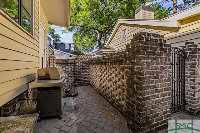 52-56 E Broad St, Savannah, GA 31401 - view of patio / terrace with a gate and area for grilling
