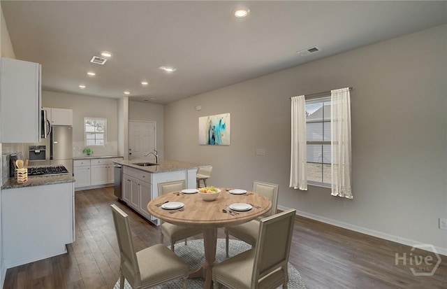 131 Crimson Ln, Savannah, GA 31302 - dining area featuring dark wood-style flooring and recessed lighting