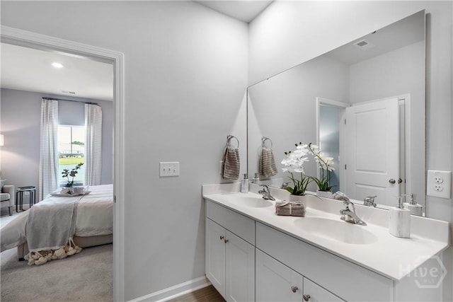 131 Crimson Ln, Savannah, GA 31302 - ensuite bathroom featuring double vanity and baseboards