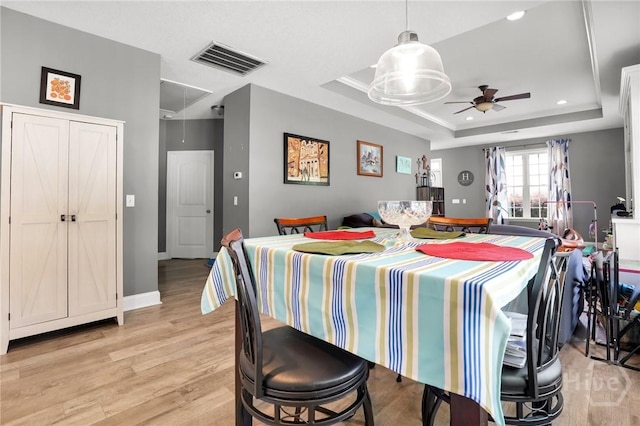 1416 Hillridge Dr, Darien, GA 31305 - dining area with attic access, ceiling fan, light wood-style flooring, a tray ceiling, and recessed lighting