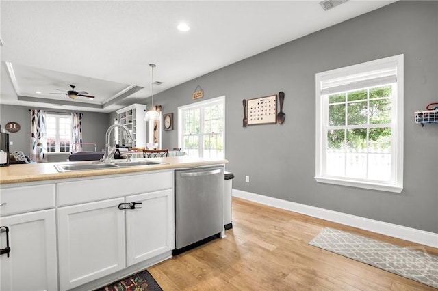1416 Hillridge Dr, Darien, GA 31305 - kitchen featuring dishwasher, light wood-style floors, white cabinets, pendant lighting, and recessed lighting