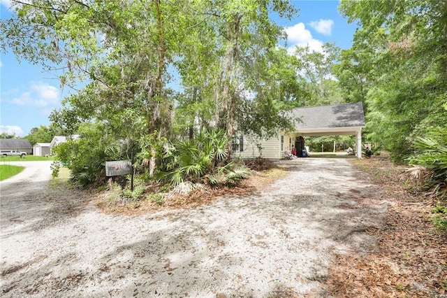 1416 Hillridge Dr, Darien, GA 31305 - obstructed view of property with dirt driveway and an attached carport