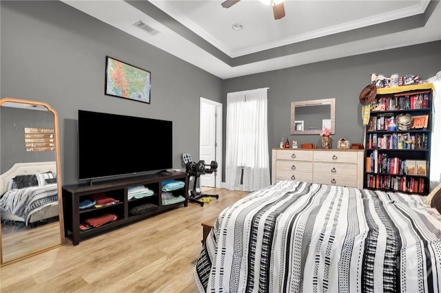 1416 Hillridge Dr, Darien, GA 31305 - bedroom with a raised ceiling, ornamental molding, wood finished floors, and ceiling fan