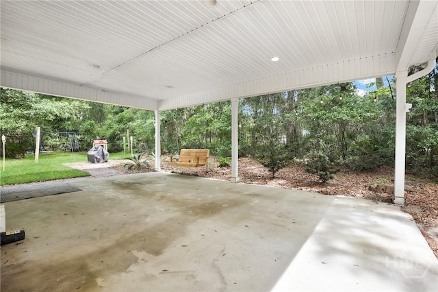 1416 Hillridge Dr, Darien, GA 31305 - view of patio with a carport and view of wooded area