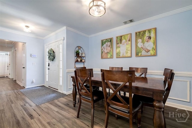 26 Dianne Mackenzie Way, Savannah, GA 31419 - dining space with wood finished floors, crown molding, wainscoting, and attic access