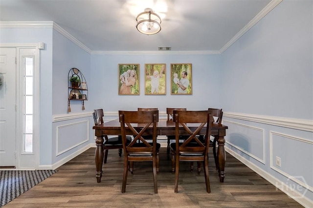 26 Dianne Mackenzie Way, Savannah, GA 31419 - dining space featuring plenty of natural light, ornamental molding, wood finished floors, a decorative wall, and a wainscoted wall