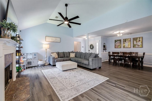 26 Dianne Mackenzie Way, Savannah, GA 31419 - living room with a fireplace with raised hearth, ceiling fan, dark wood finished floors, and lofted ceiling