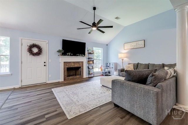 26 Dianne Mackenzie Way, Savannah, GA 31419 - living room featuring ornate columns, ceiling fan, wood finished floors, vaulted ceiling, and a fireplace