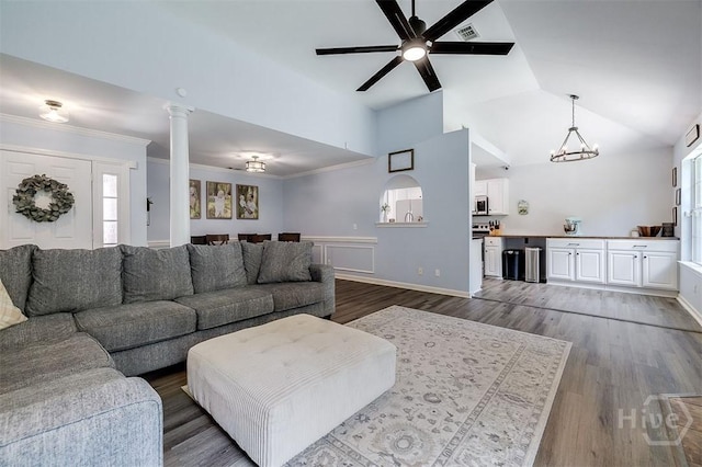 26 Dianne Mackenzie Way, Savannah, GA 31419 - living room with a chandelier, a ceiling fan, dark wood finished floors, wainscoting, and decorative columns