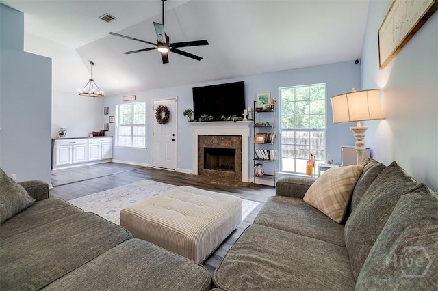 26 Dianne Mackenzie Way, Savannah, GA 31419 - living room with vaulted ceiling, ceiling fan, healthy amount of natural light, a high end fireplace, and wood finished floors