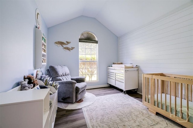 26 Dianne Mackenzie Way, Savannah, GA 31419 - bedroom featuring wood finished floors, a nursery area, and vaulted ceiling
