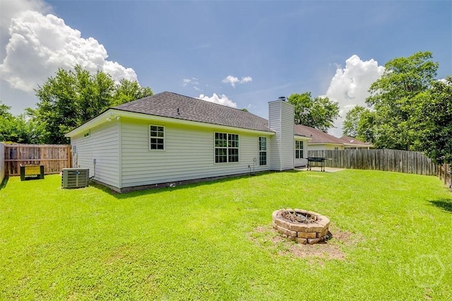 26 Dianne Mackenzie Way, Savannah, GA 31419 - rear view of property with an outdoor fire pit, a fenced backyard, a shingled roof, and a chimney