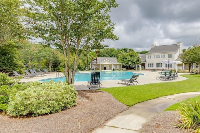 26 Dianne Mackenzie Way, Savannah, GA 31419 - community pool featuring a patio area and a lawn
