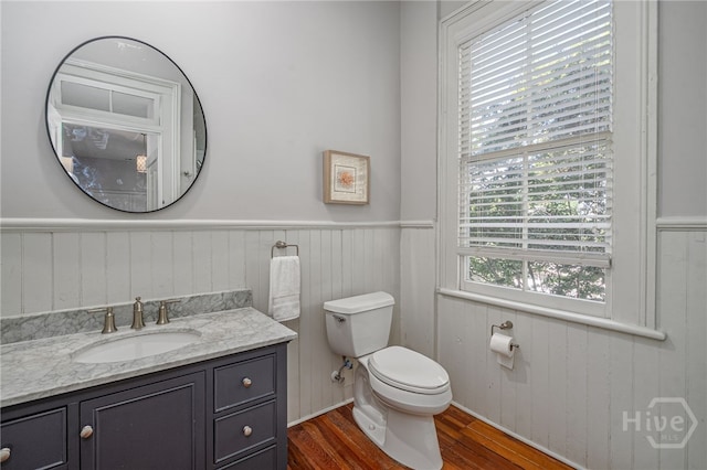 121 W Bolton St, Savannah, GA 31401 - half bathroom featuring wood finished floors, a wainscoted wall, and vanity