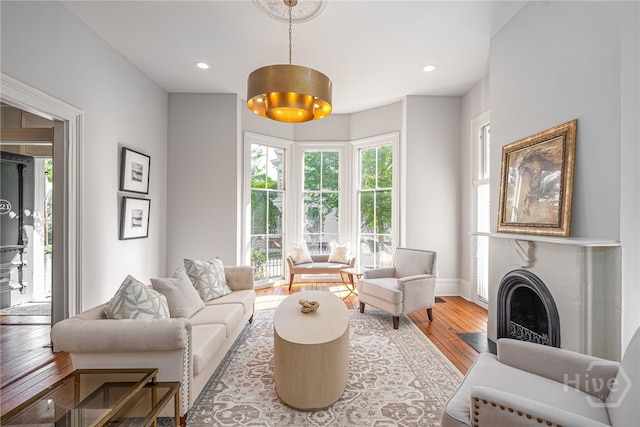 121 W Bolton St, Savannah, GA 31401 - living room with hardwood / wood-style floors, plenty of natural light, a fireplace with flush hearth, and recessed lighting