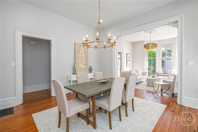 121 W Bolton St, Savannah, GA 31401 - dining space with hardwood / wood-style flooring and a chandelier
