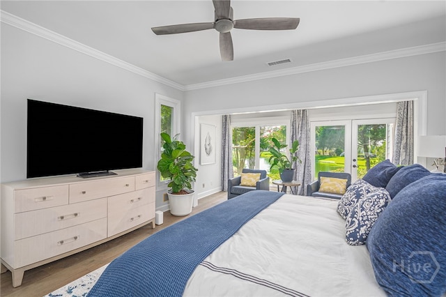 1 Broomsedge Ln, Savannah, GA 31411 - bedroom with crown molding, multiple windows, access to exterior, wood finished floors, and a ceiling fan