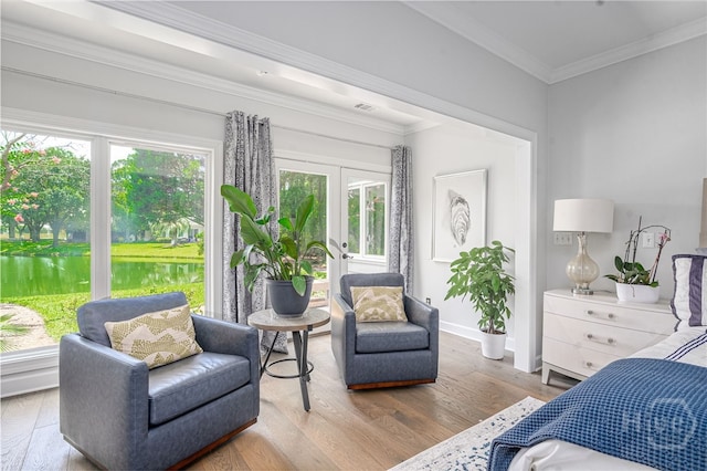 1 Broomsedge Ln, Savannah, GA 31411 - bedroom featuring multiple windows, wood finished floors, ornamental molding, and french doors
