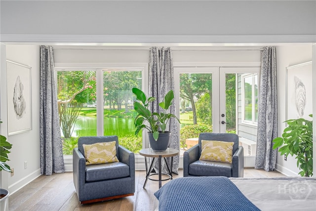 1 Broomsedge Ln, Savannah, GA 31411 - sitting room featuring french doors, plenty of natural light, and wood finished floors