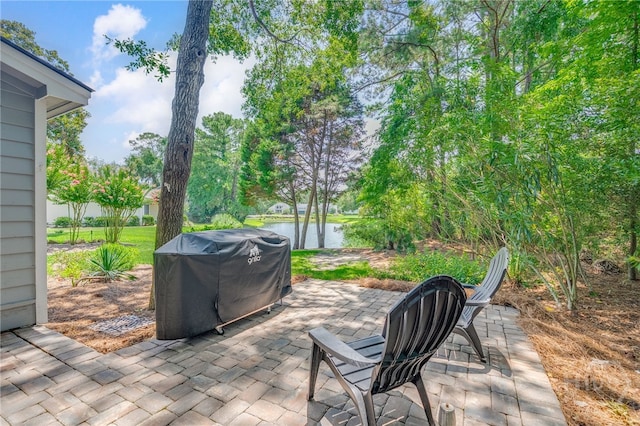 1 Broomsedge Ln, Savannah, GA 31411 - view of patio / terrace with a grill and a water view