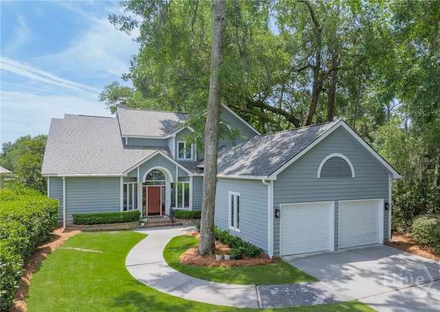 1 Broomsedge Ln, Savannah, GA 31411 - traditional home featuring a shingled roof, driveway, and a front yard