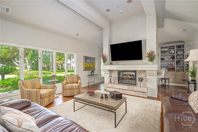 32 Hasleiters Retreat Retreat, Savannah, GA 31411 - living area featuring wood finished floors, vaulted ceiling, and a fireplace