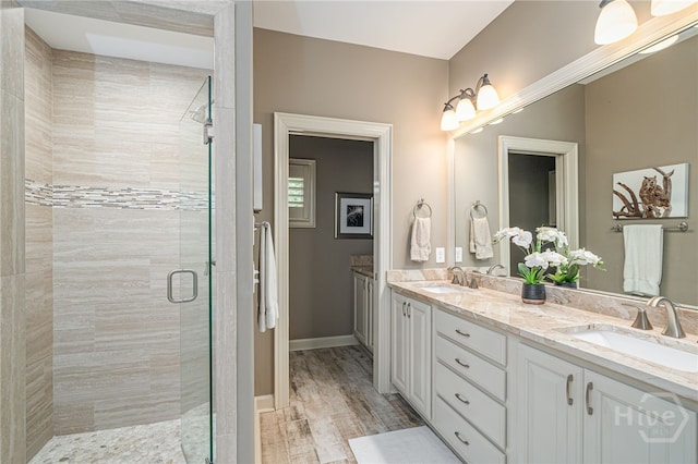 32 Hasleiters Retreat Retreat, Savannah, GA 31411 - bathroom featuring double vanity, a shower stall, and wood finished floors