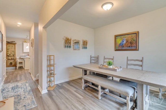 1057 Waybridge Way, Richmond Hill, GA 31324 - dining space featuring light wood finished floors and baseboards